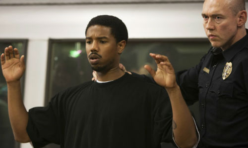 Oscar is brusquely escorted off the train by one of the BART police officers who unwittingly demonstrate via their heavy-handed approach that much remains to be done in bringing about true justice in American society (image via quickflix.com)
