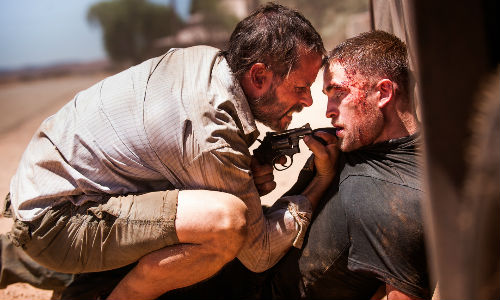 Guy Pearce and Robert Pattinson play two men in a "dangerous and damaged near future" who must find a car and an important object it contains (image via therover.com)