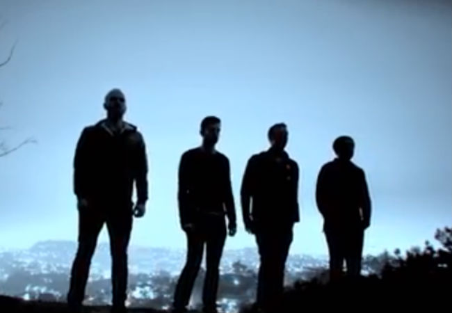 Coldplay in the pre dawn light (image via Youtube.com)