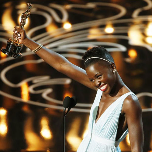 A picture of heart warming joy, Lupita Nyong'o accepts her Oscar (image via voanews.com (c) Reuters)