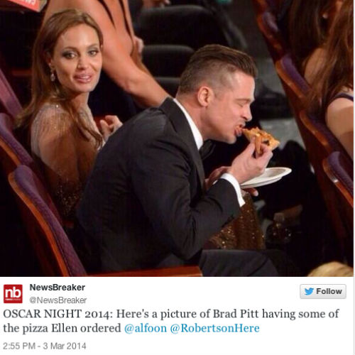 Brad Pitt inhales his slice o' pizza courtesy of Ellen's mid telecast order (image via cinemablend.com)