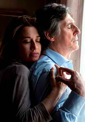 Needing each other in ways neither can reasonably articulate, their first real connection is a long, slow hug standing in the window of the man's hotel room (image via byrneperfection.wordpress.com)