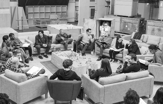 April 29th, Pinewood Studios, UK - Writer/Director/Producer J.J Abrams (top center right) at the cast read-through of Star Wars Episode VII at Pinewood Studios with (clockwise from right) Harrison Ford, Daisy Ridley, Carrie Fisher, Peter Mayhew, Producer Bryan Burk, Lucasfilm President and Producer Kathleen Kennedy, Domhnall Gleeson, Anthony Daniels, Mark Hamill, Andy Serkis, Oscar Isaac, John Boyega, Adam Driver and Writer Lawrence Kasdan. Copyright and Photo Credit: David James. (via Star Wars official site)