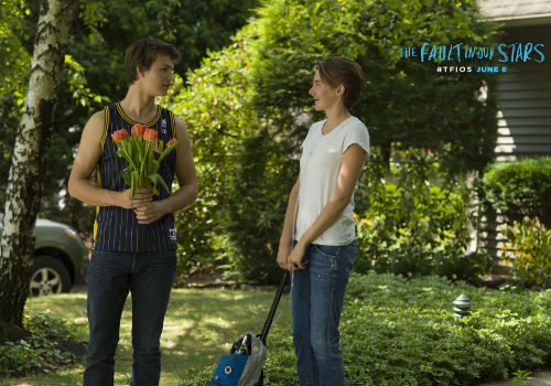 Gus and Hazel share a warmth and intimacy borne of shared trauma and an unwillingness to let the well-meaning sentiments of inspirational posters define them (image via official The Fault in our Stars movie site)