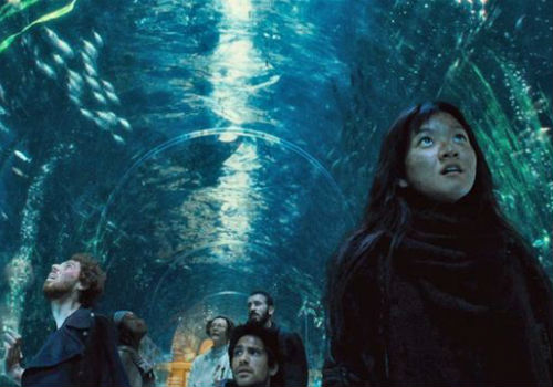 Unused to the many luxuries of the front end of the train, the rebels wander through the aquarium carriage awe-struck and speechless, a brief respite from the pell-mell violence of their quest for equality and humanity (image via Movie Mezzanine)