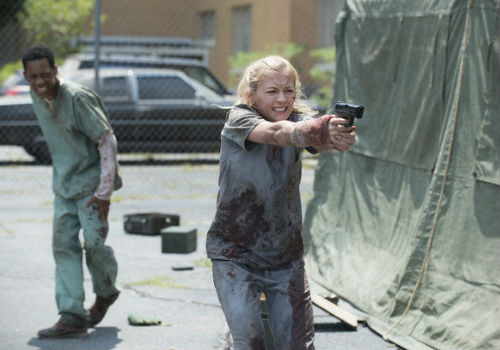Run away! Run away! Or limp away if you're Noah who injures himself as the two attempt to escape the hospital by leaping down an elevator shaft full of corpses (all thankfully non-zombied) (image via Oregon Live (c) AMC)