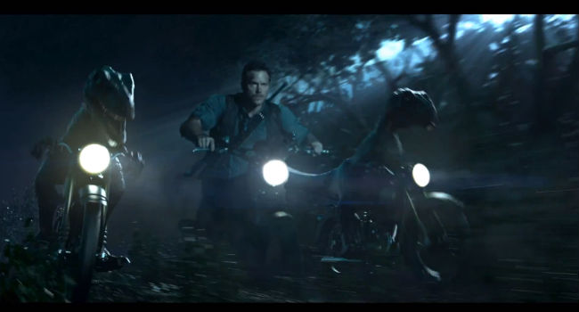 Velociraptors on motorbikes are go! (image via YouTube (c) Darren Wallace)
