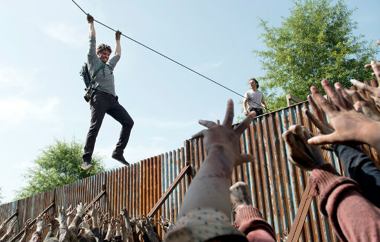 Easing himself rather inelegantly over the undead remains of the Justin Bieber fan club, who assumed it was their idol inching his way across their hungry herd, Spencer decides it's high time he Helped People by, you know, almost killing them as they tried to save him. Genius! (image courtesy AMC)